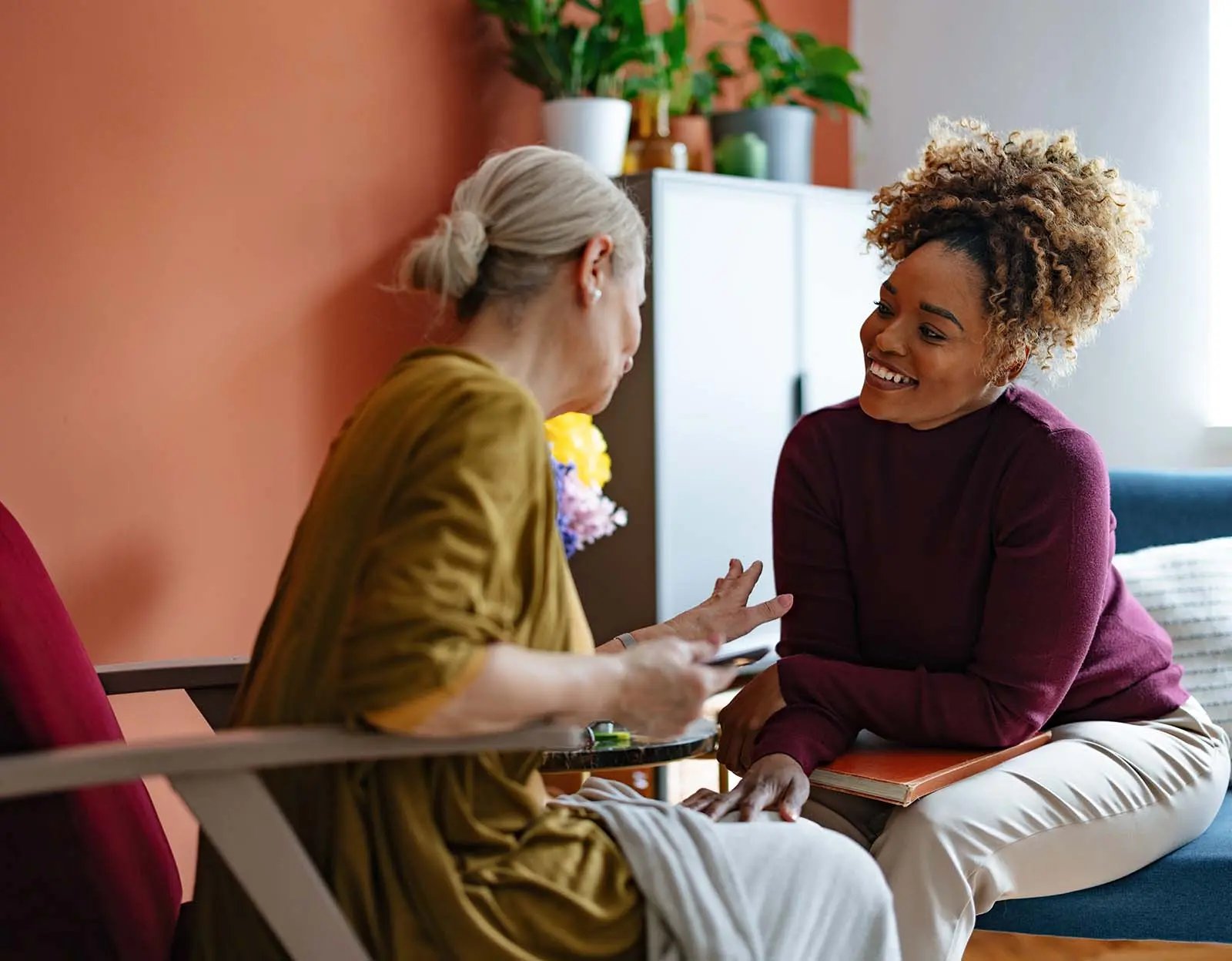 Two people in a warm, informal conversation